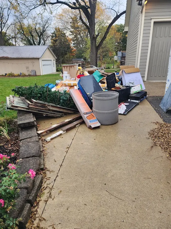 Dumpster being loaded with debris for Estate Cleanout Dumpster Rental in Roseburg North